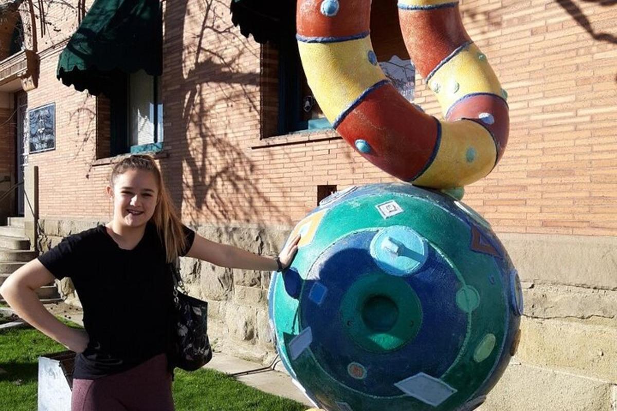 a woman standing in front of a large ball