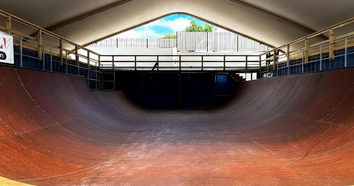 a large skateboard ramp in a skate park