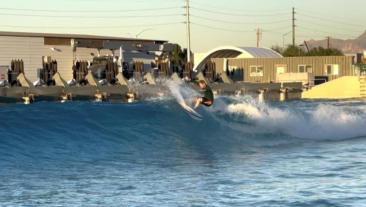 a man riding a wave on a surfboard in the water