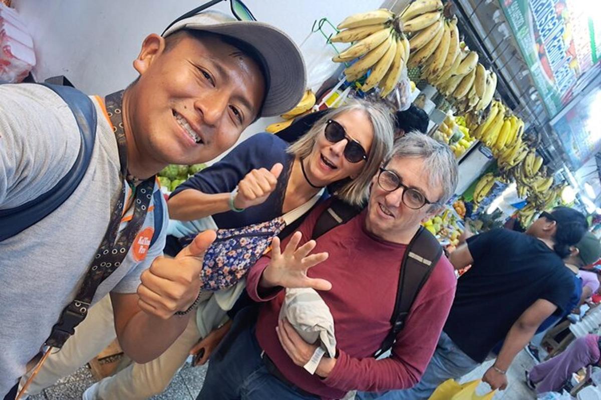a group of people posing for a picture with bananas