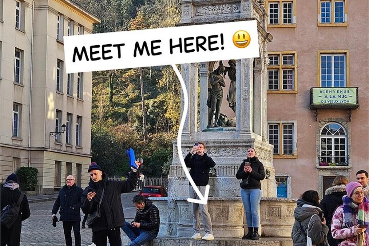 a group of people standing around a statue with a sign