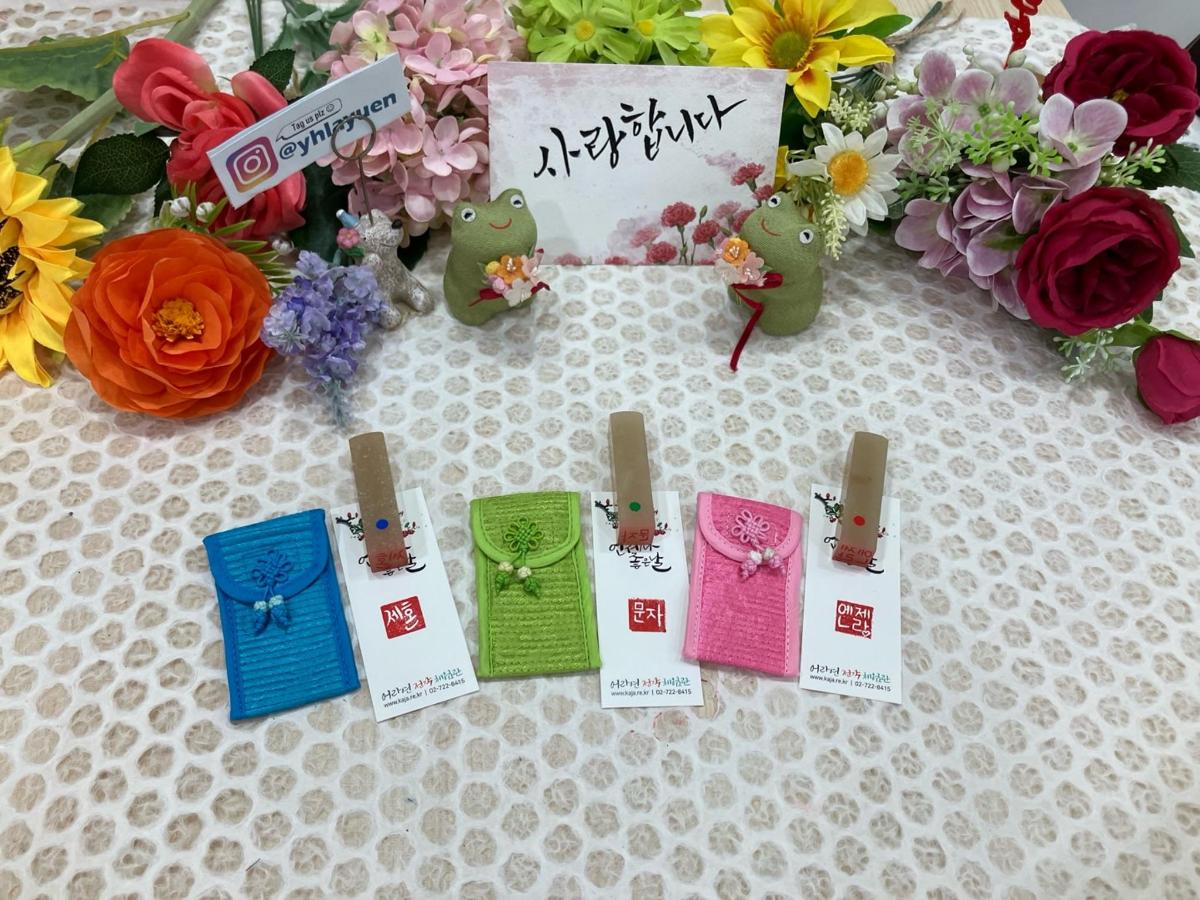 a table with some flowers and signs and someotics