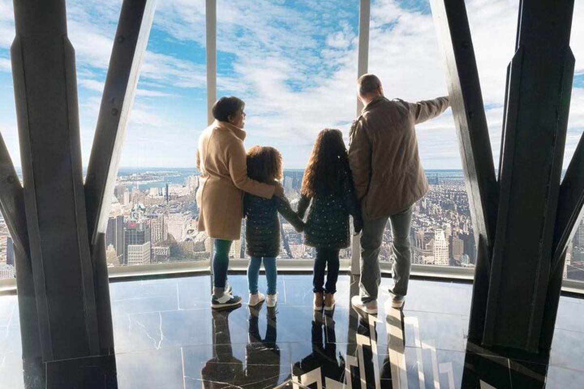 a family standing on the top of the cn tower