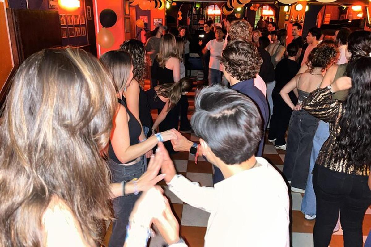 a group of people dancing at a party