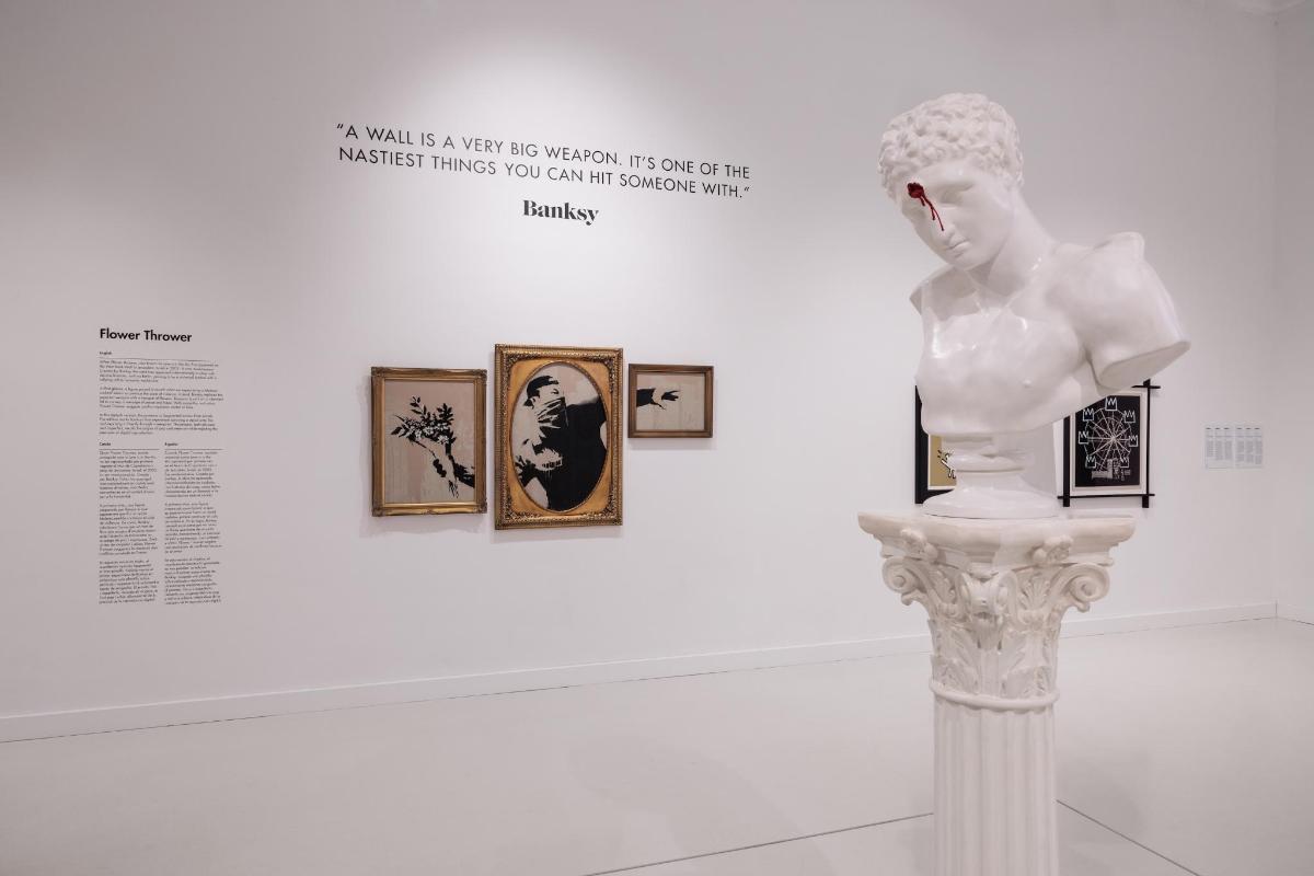 a mannequin in a white statue in a museum exhibit
