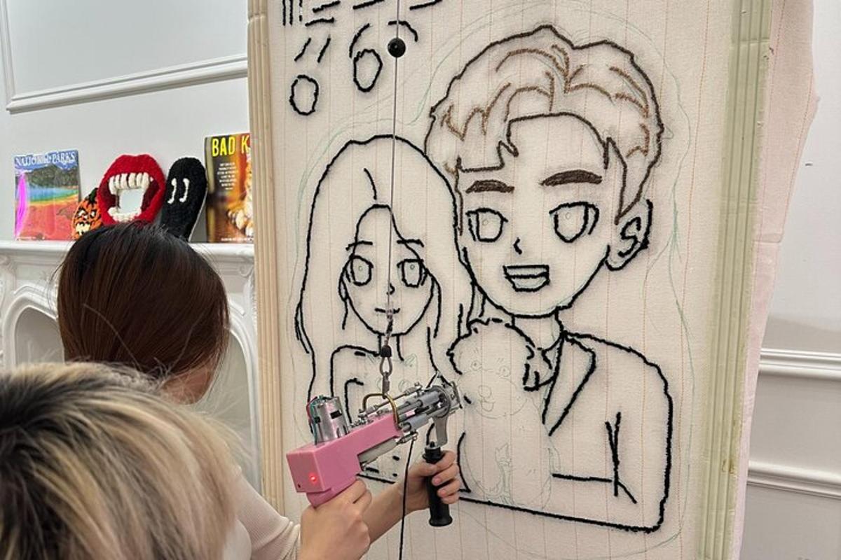 a woman painting a drawing of a girl
