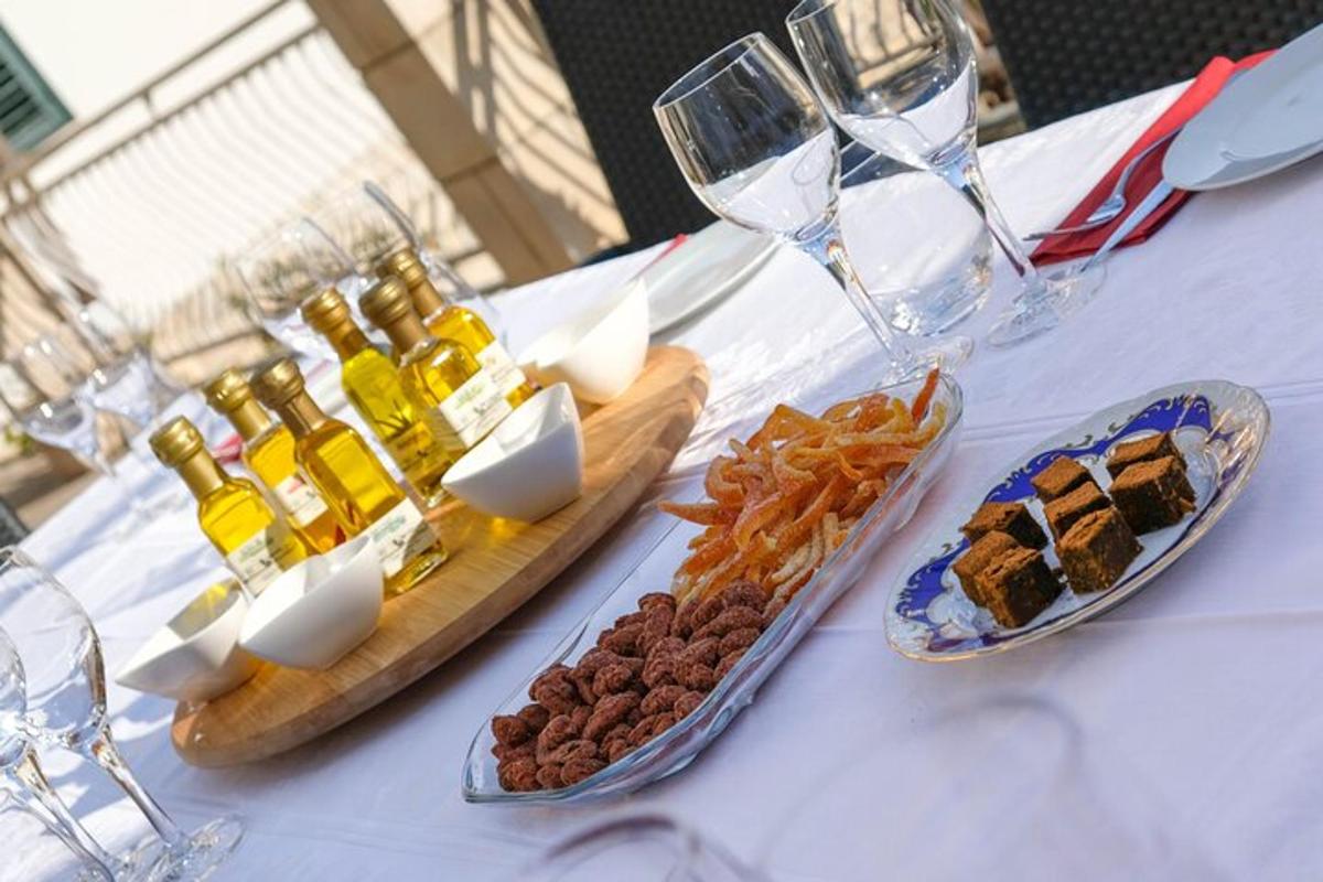 a table topped with appetizers and wine glasses and food