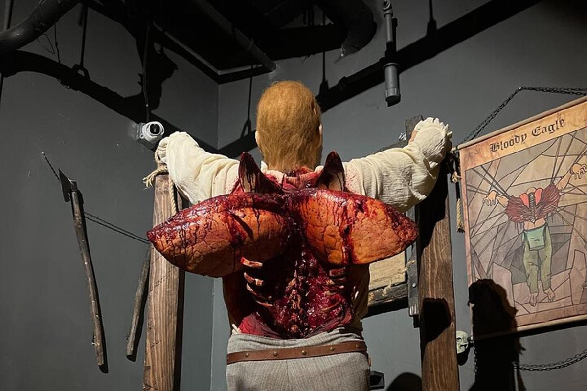 a man standing in front of a stage with a piece of meat
