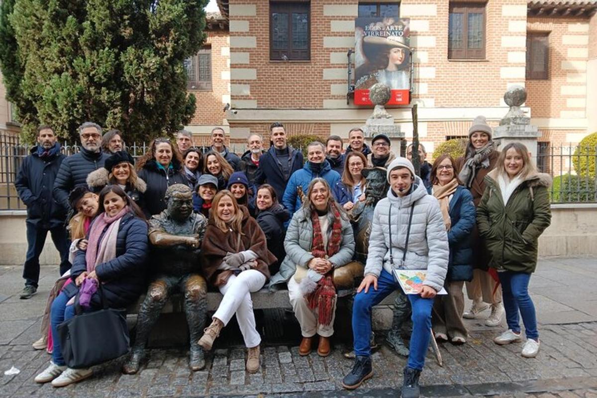 a group of people posing for a picture in front of a building