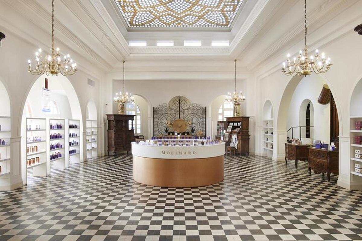 a large room with a cosmetics store with chandeliers