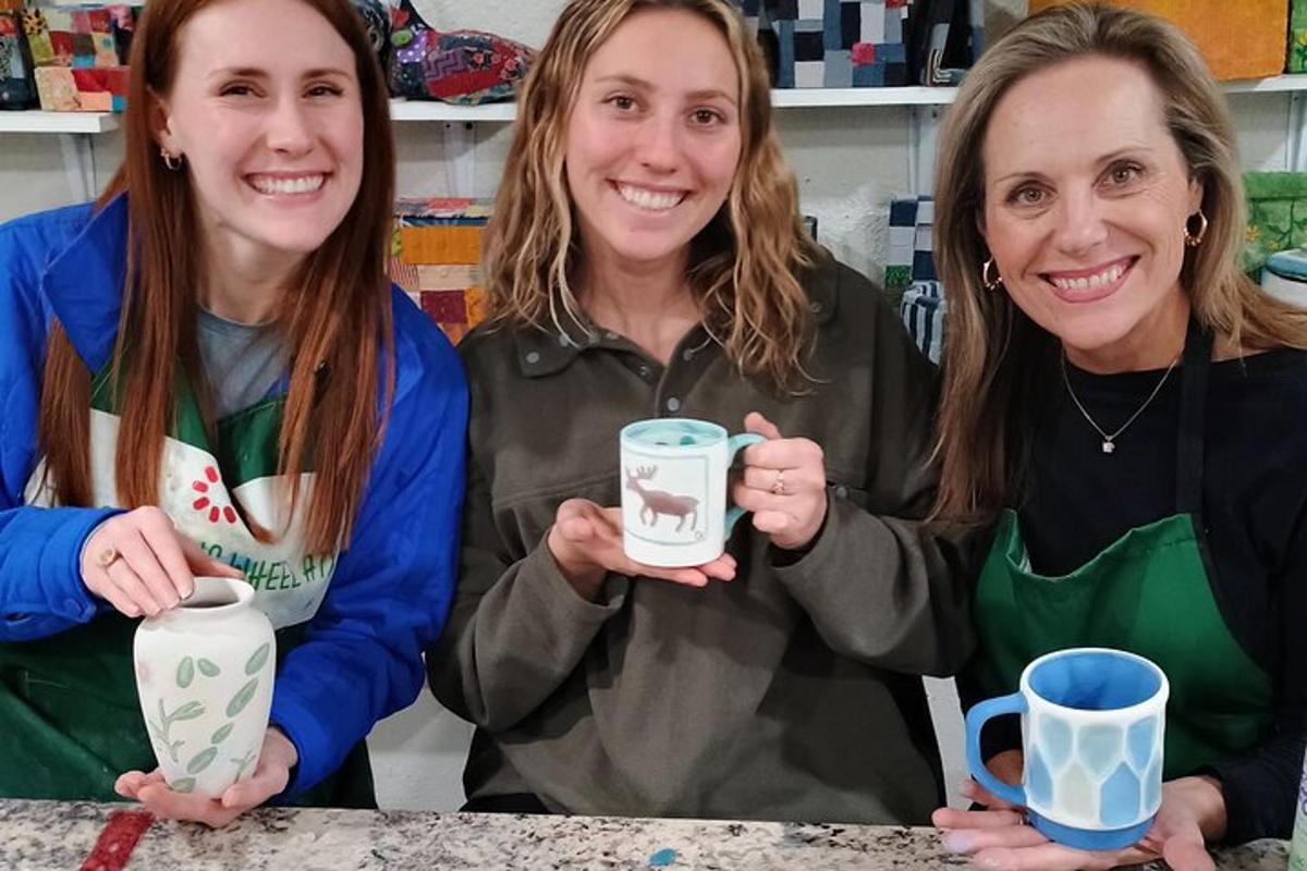 a group of three women holding up coffee mugs