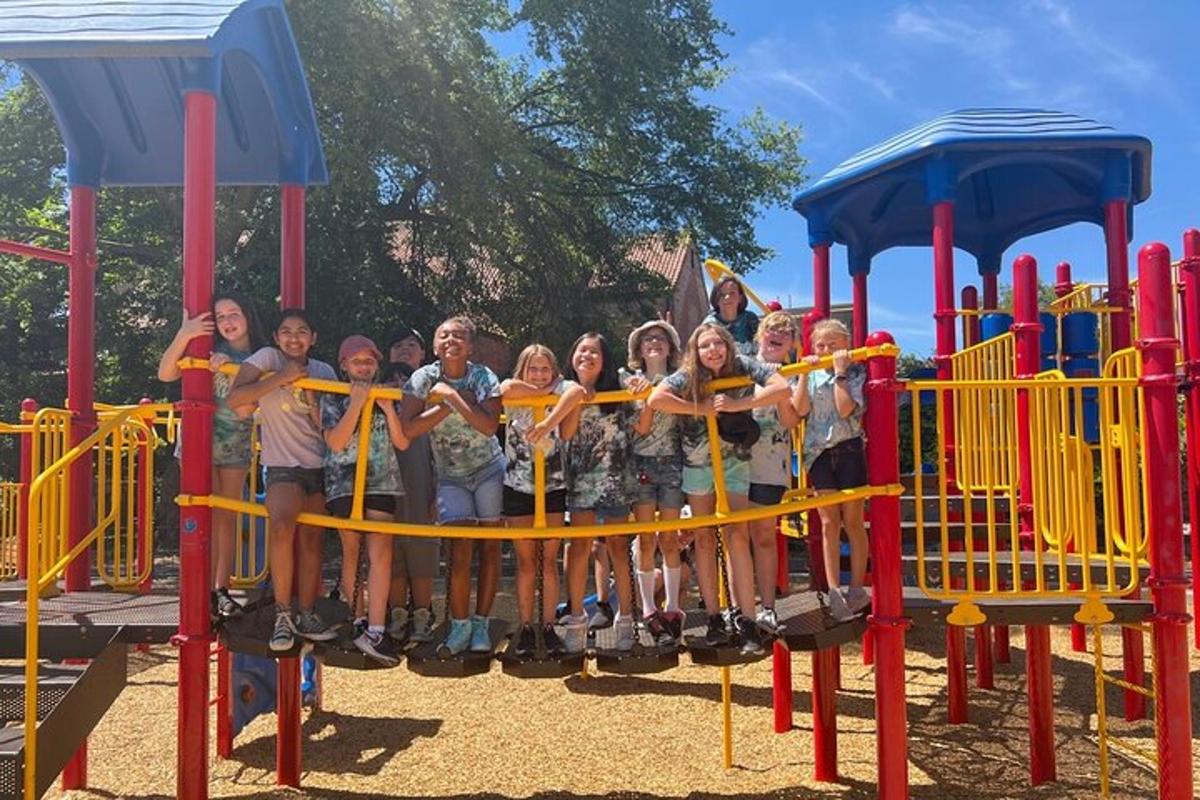 a group of people posing on a playground