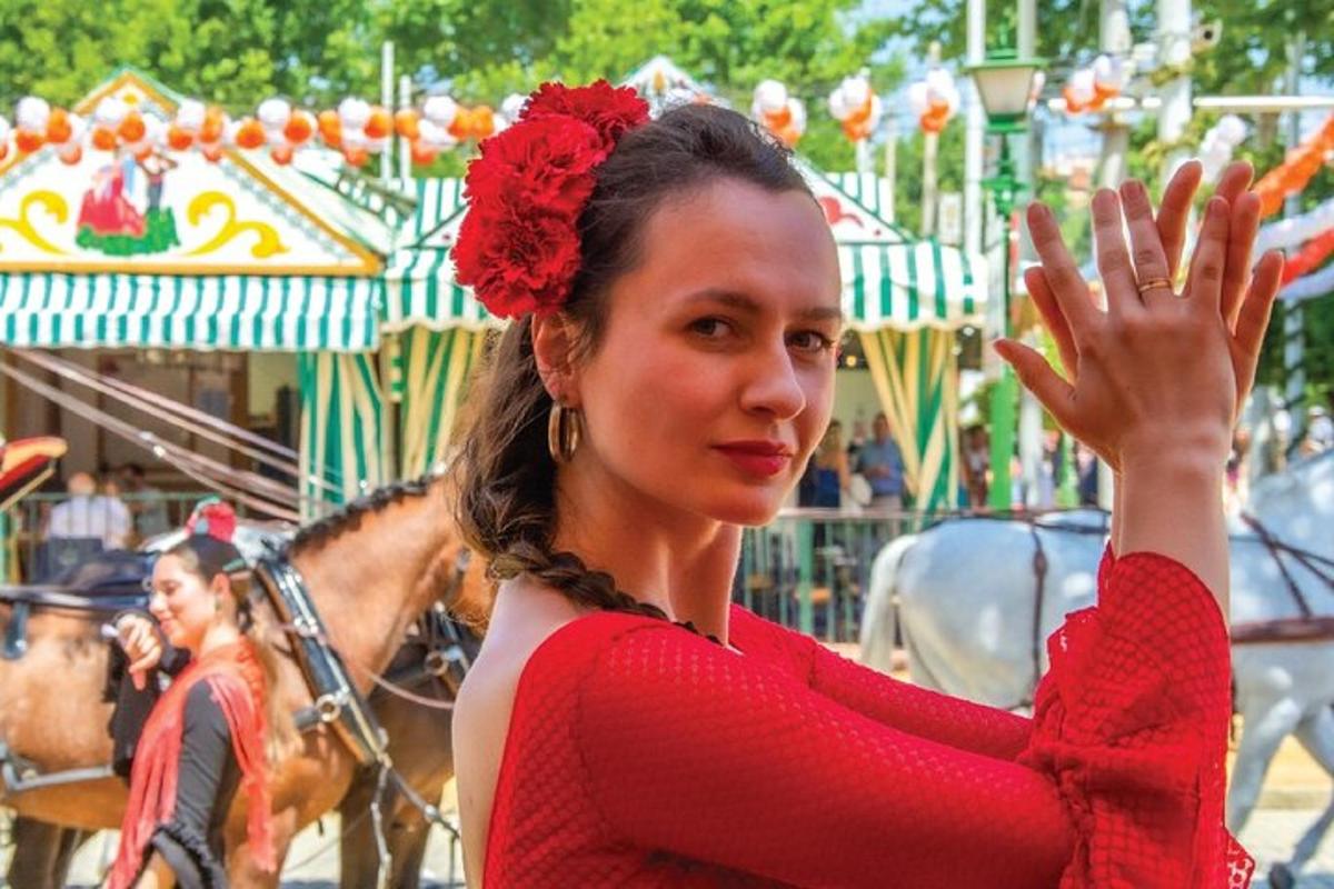 a woman in a red dress standing in front of a carousel