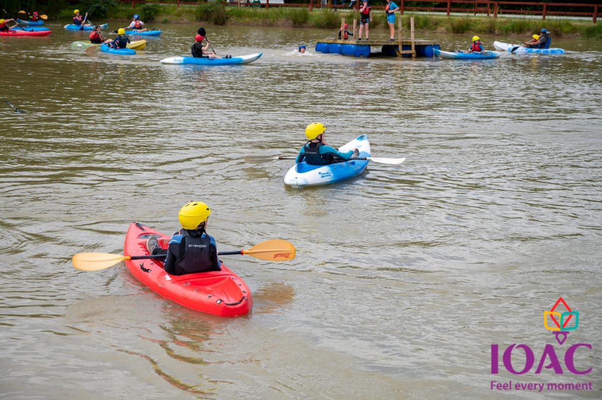 a group of people in kayaks on the water