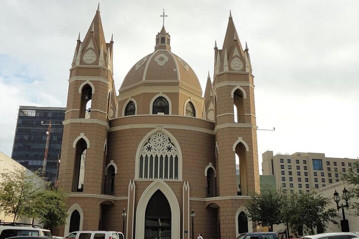 a large church with two towers with clocks on it