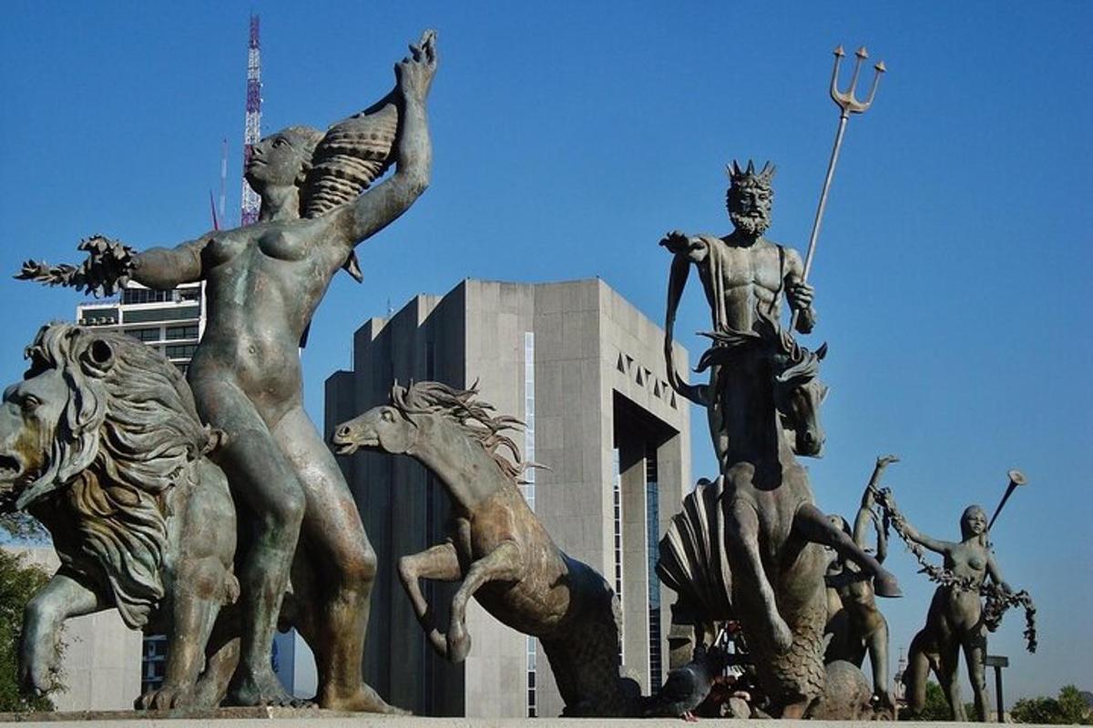 a statue of men on horses in front of a building