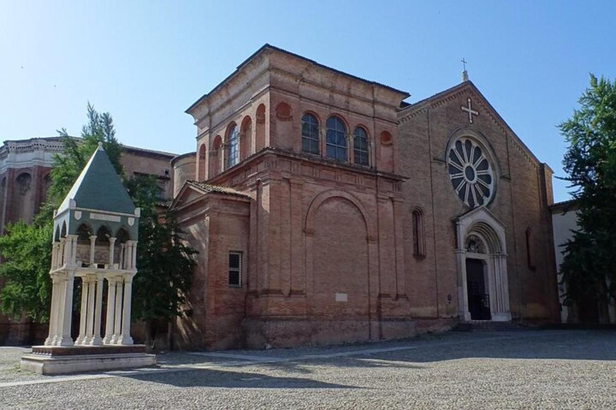 an old brick church with a clock tower in front of it