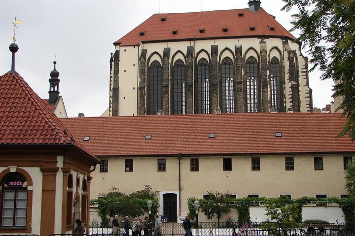 a large building with a red roof with a tower