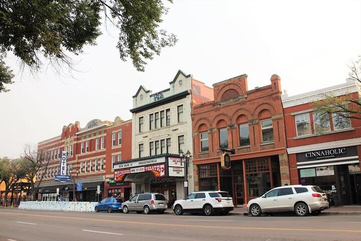 a city street with cars parked in front of buildings