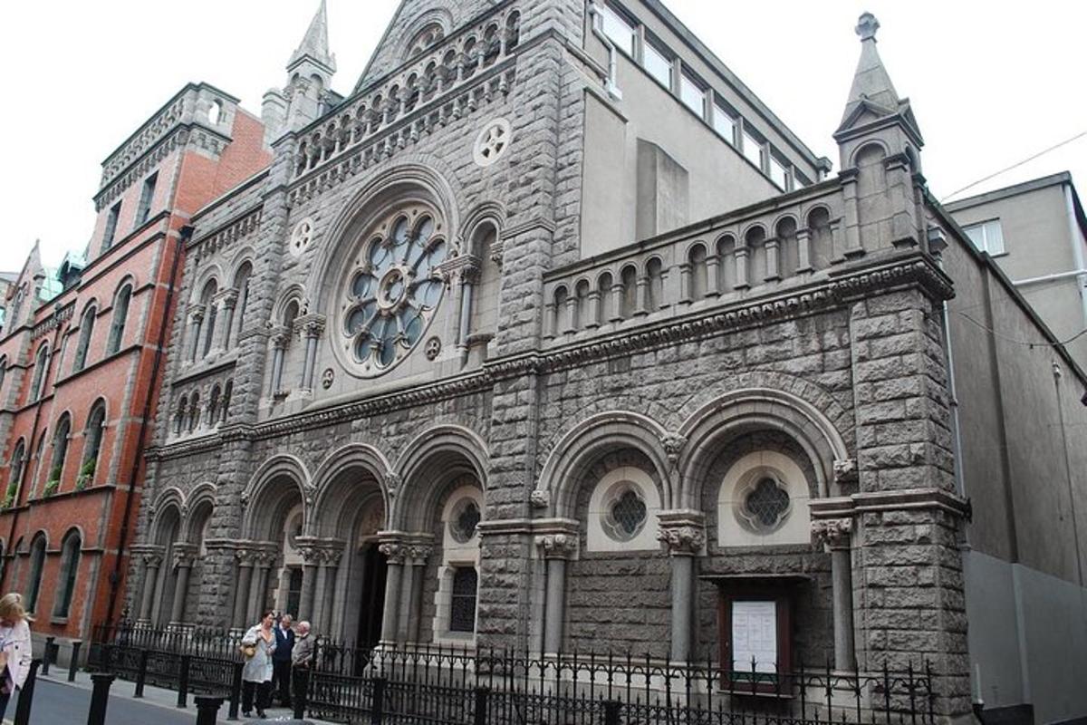 a large stone building with a clock on it