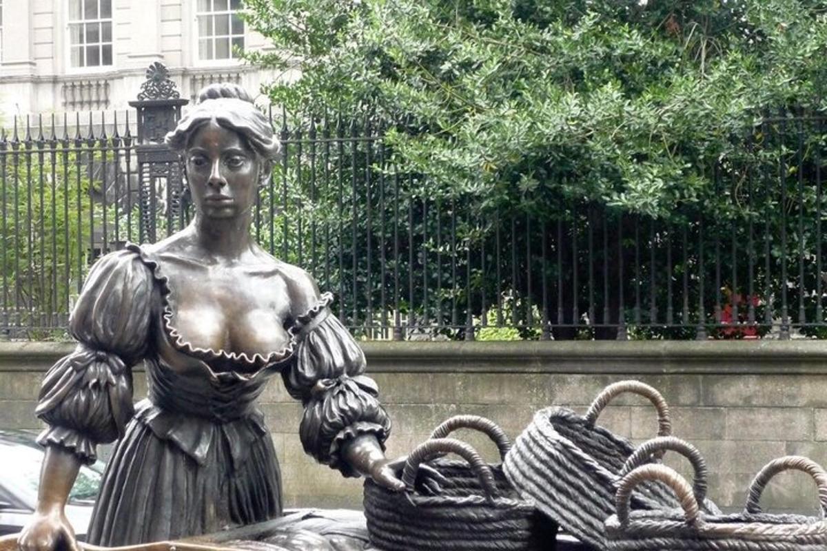 a statue of a woman holding two baskets