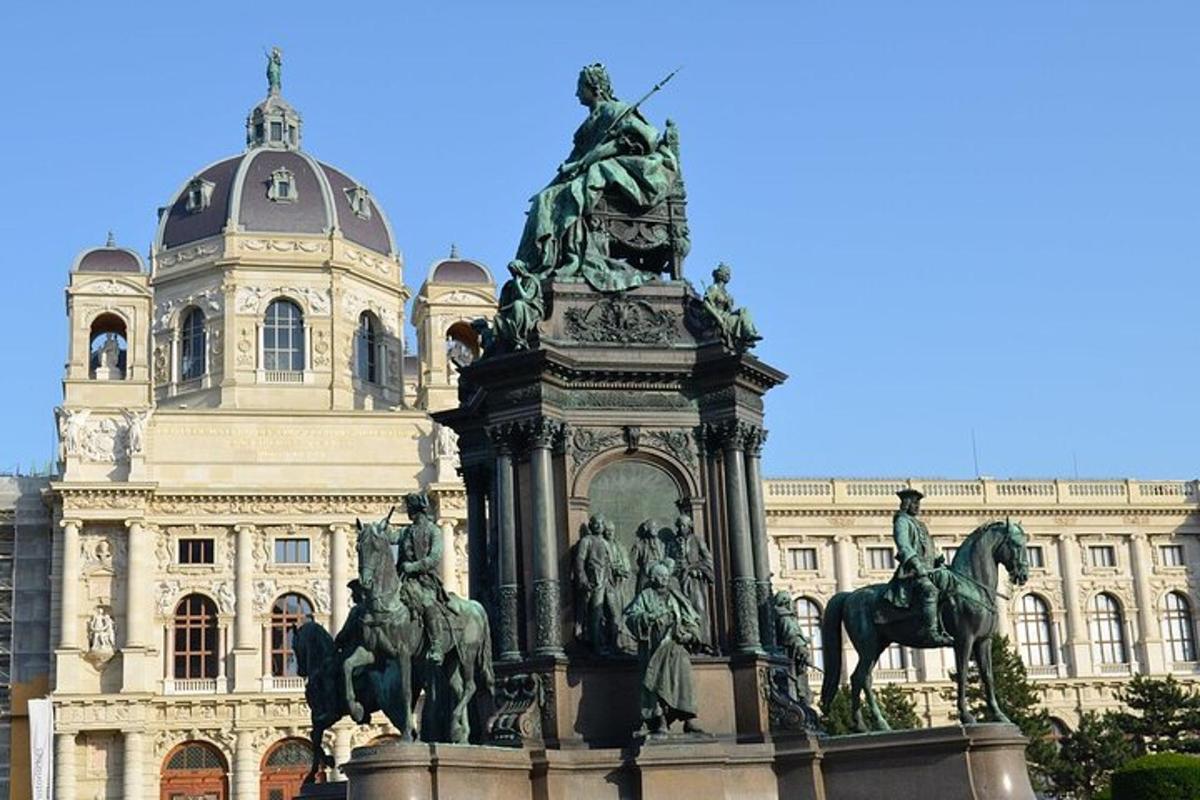 a statue of horses in front of a building