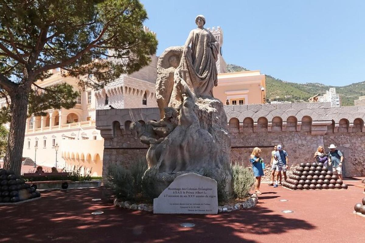 a statue of a woman standing in front of a building