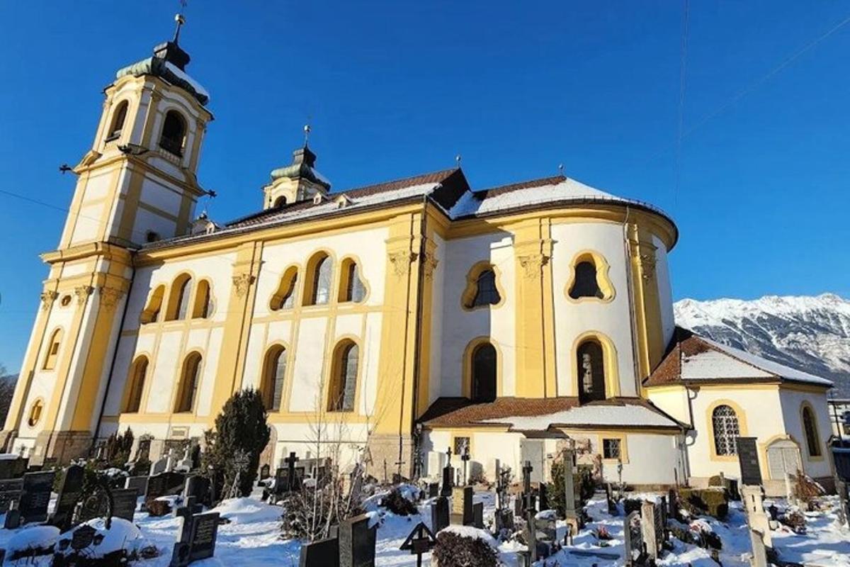a large building with a tower and a church