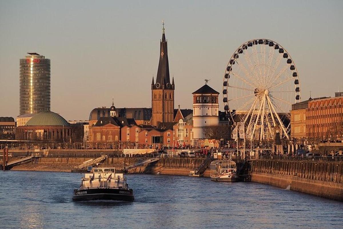 a river with a ferris wheel and a city