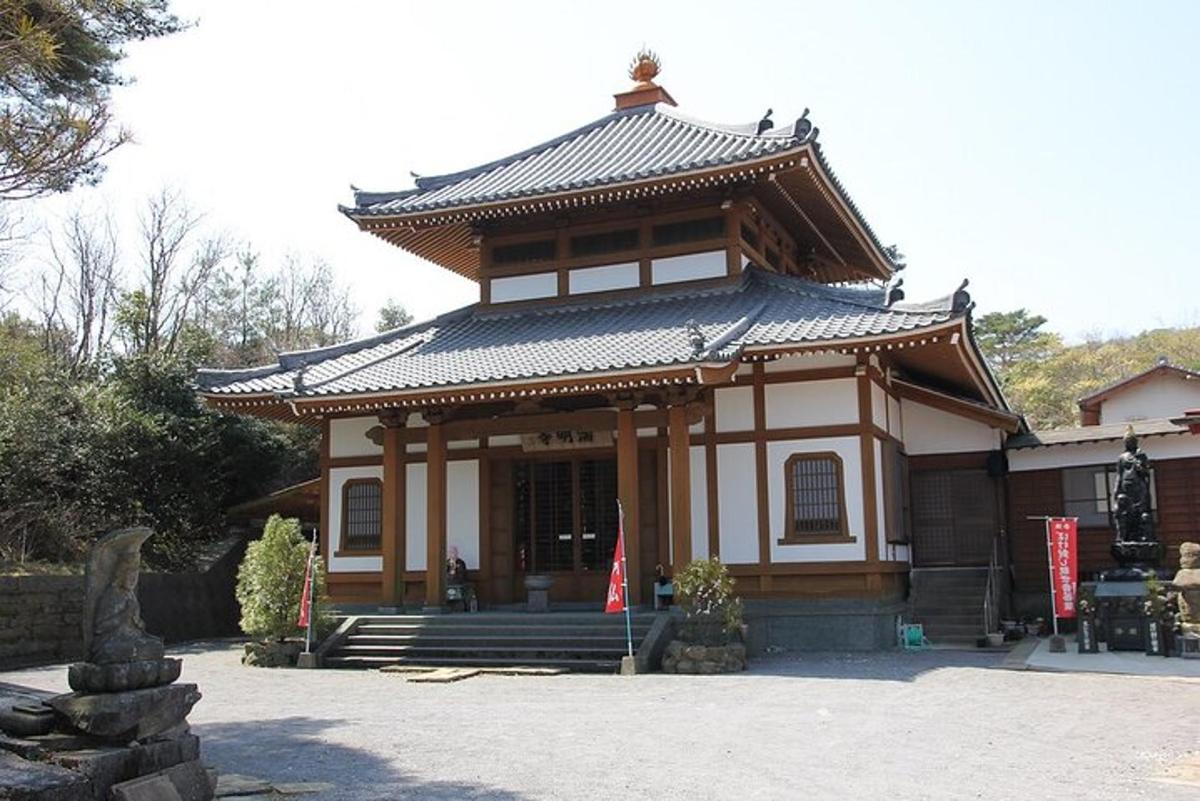 a small building with a pagoda in a park