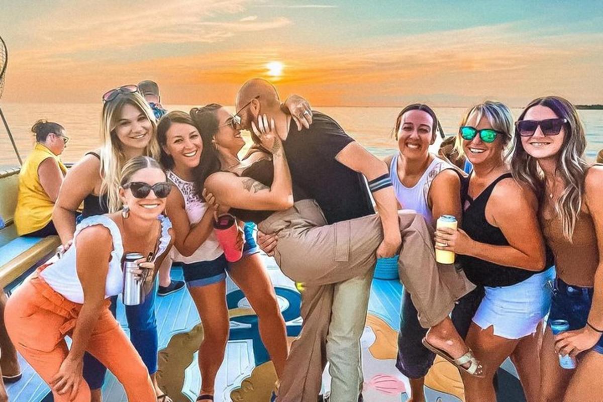 a group of people posing for a picture on a boat