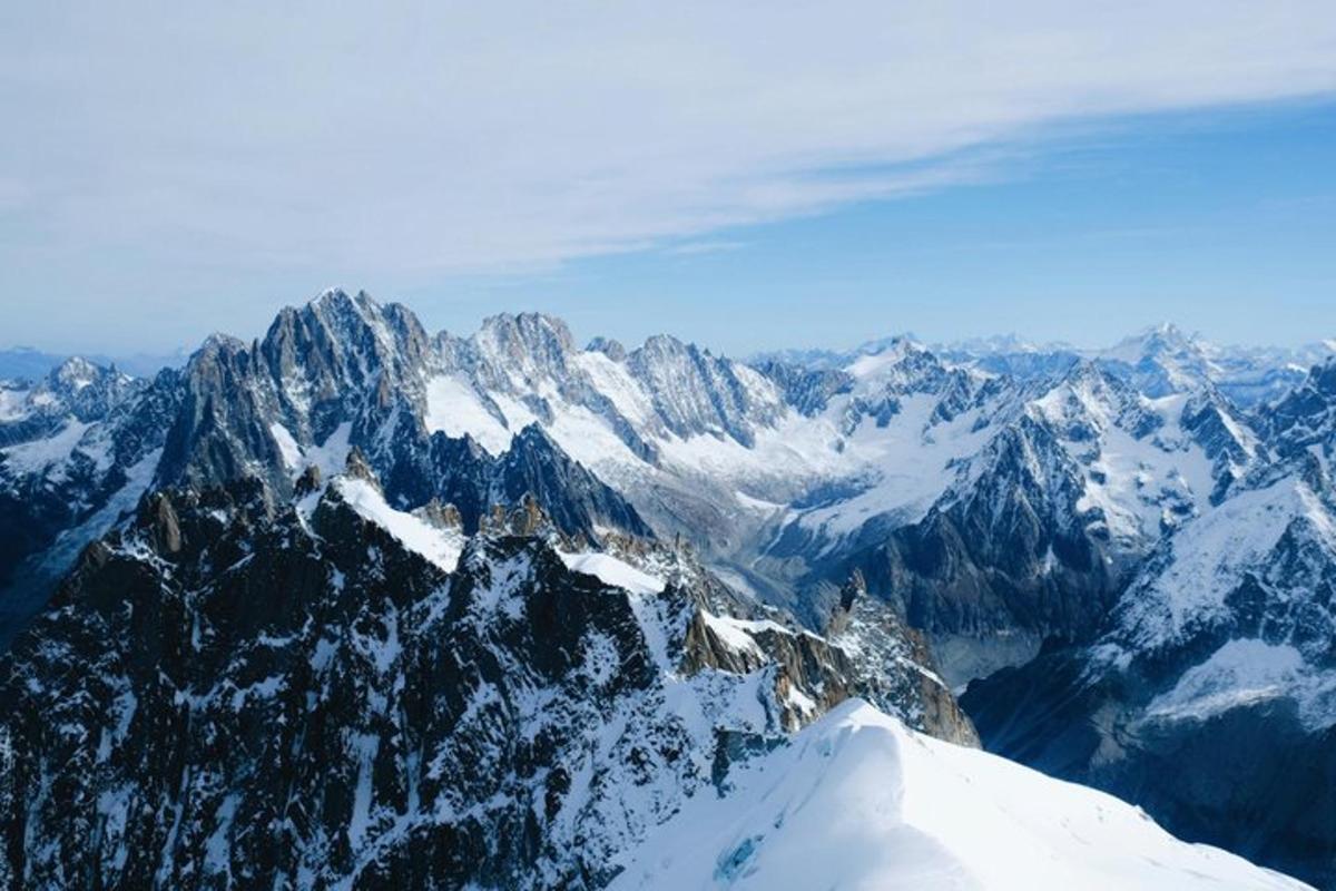 an aerial view of a snow covered mountain