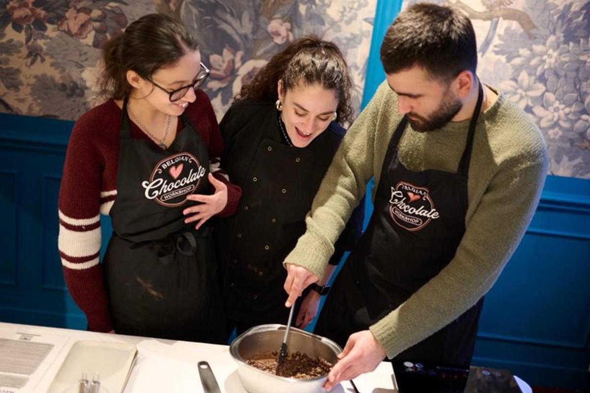 a group of people standing around a table preparing food