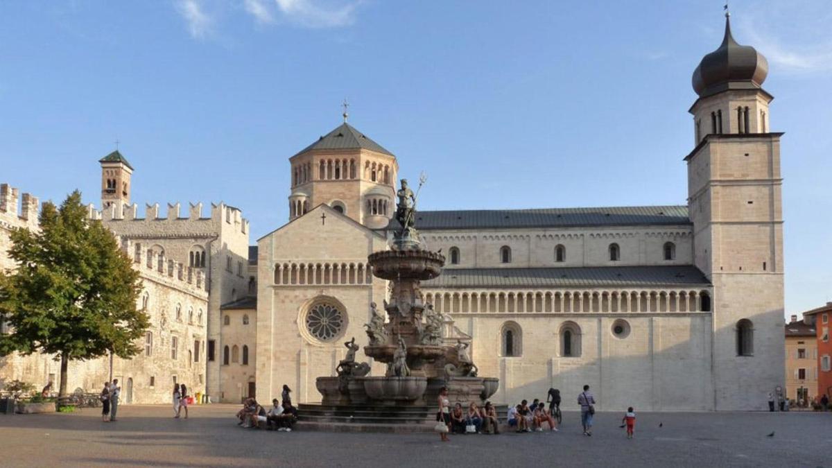 a large building with a fountain in front of it
