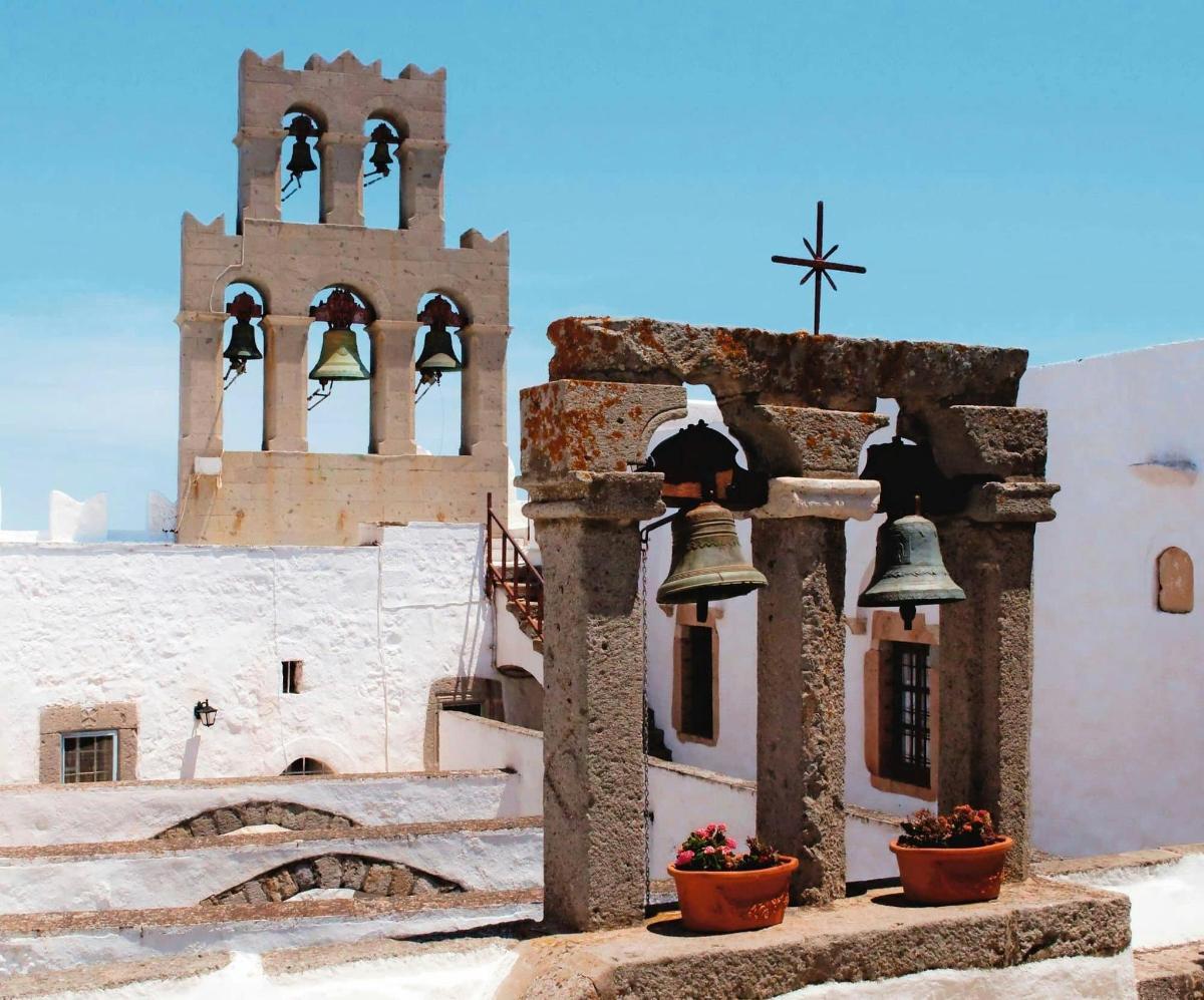 a building with bells in front of a church