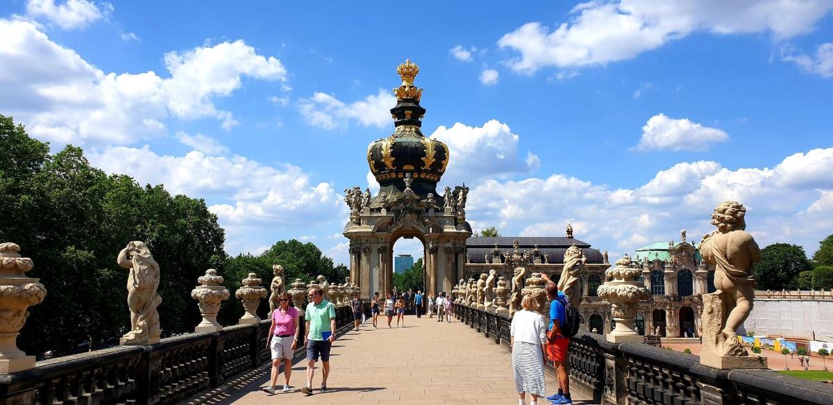 a group of people standing on a bridge