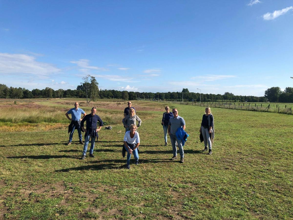 a group of people walking in a field
