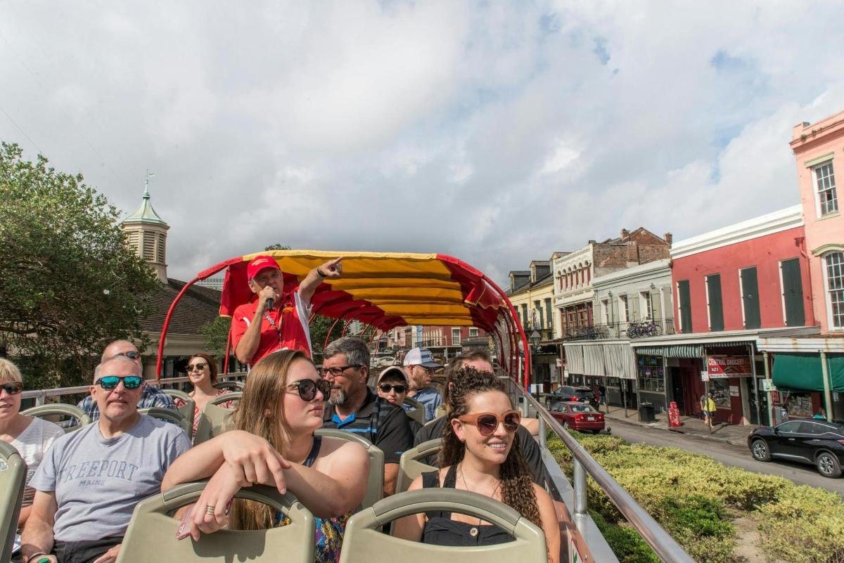 a group of people riding on a trolley