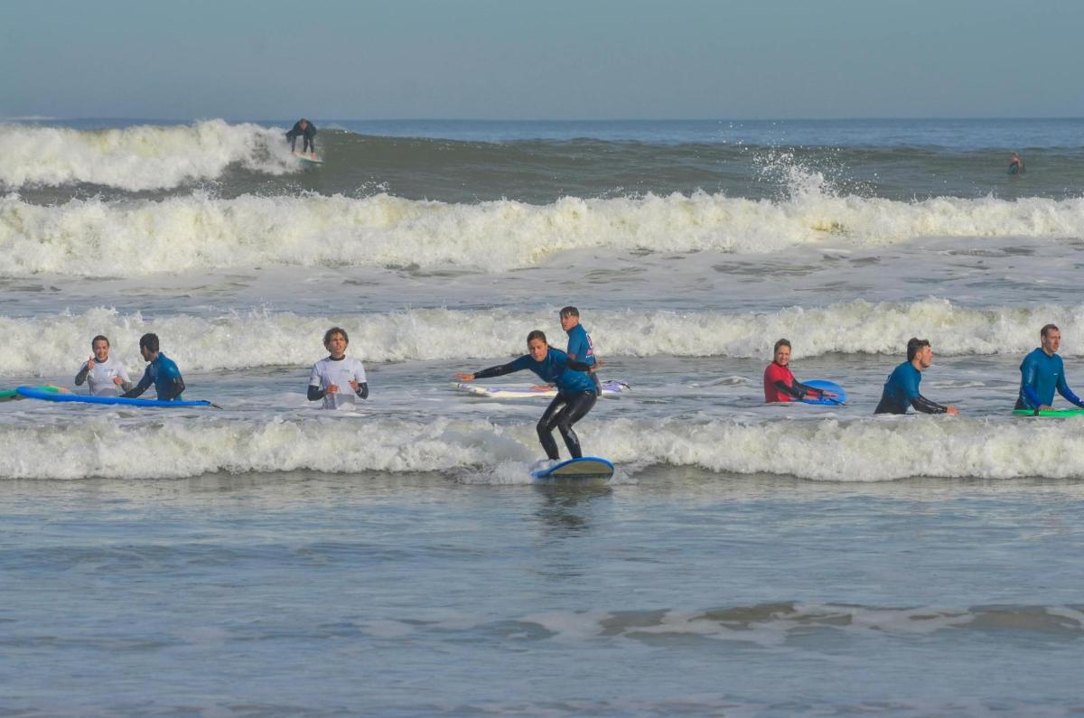 a man riding a wave on a surfboard in the ocean