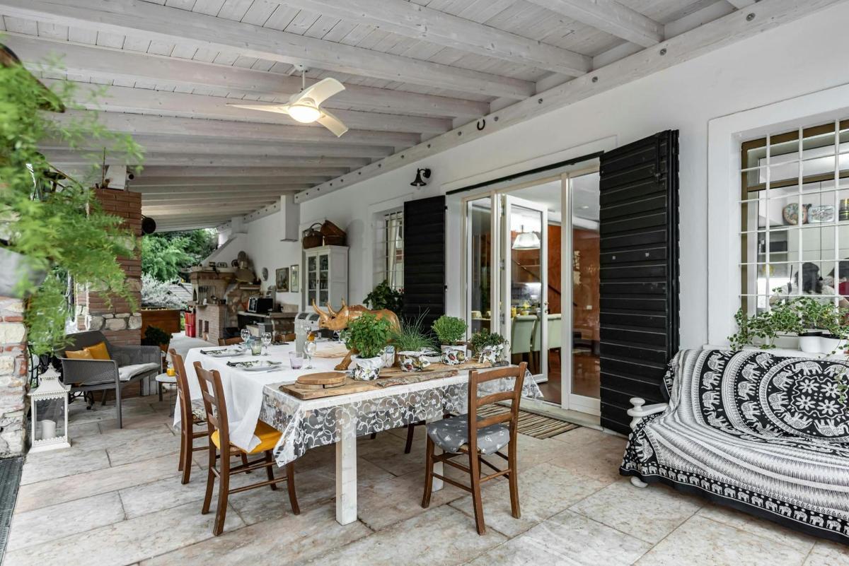 a dining table and chairs on a patio