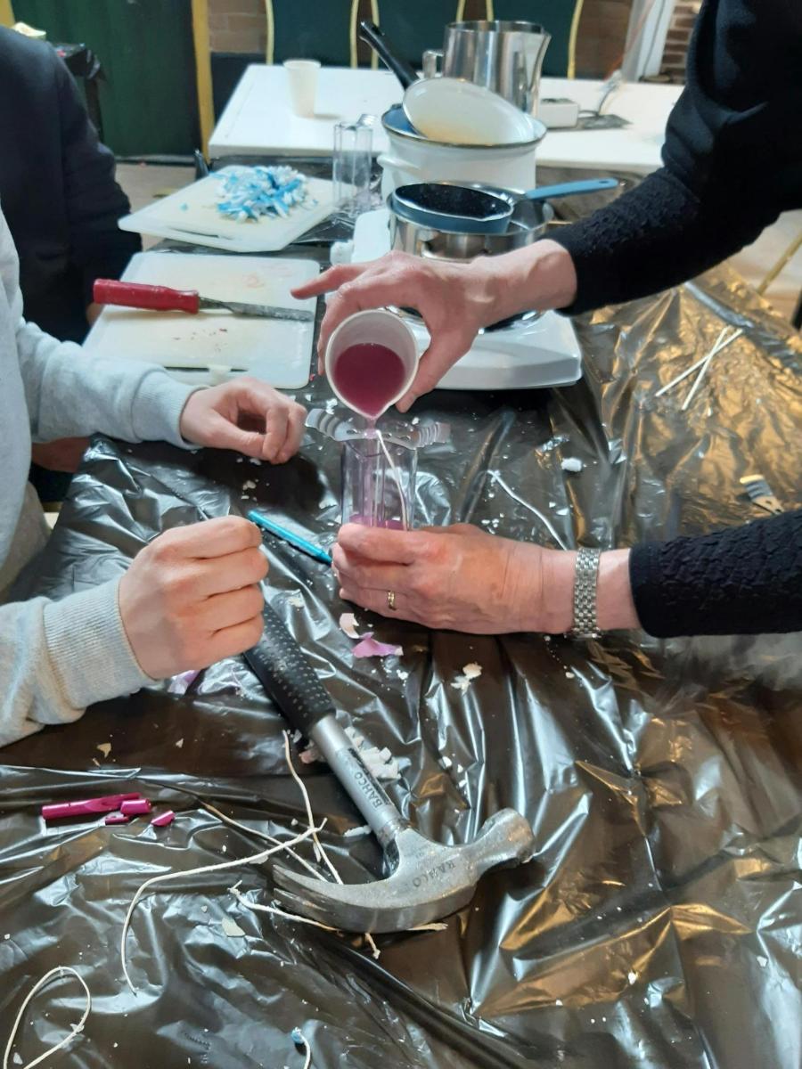 a group of people sitting around a table with wine glasses
