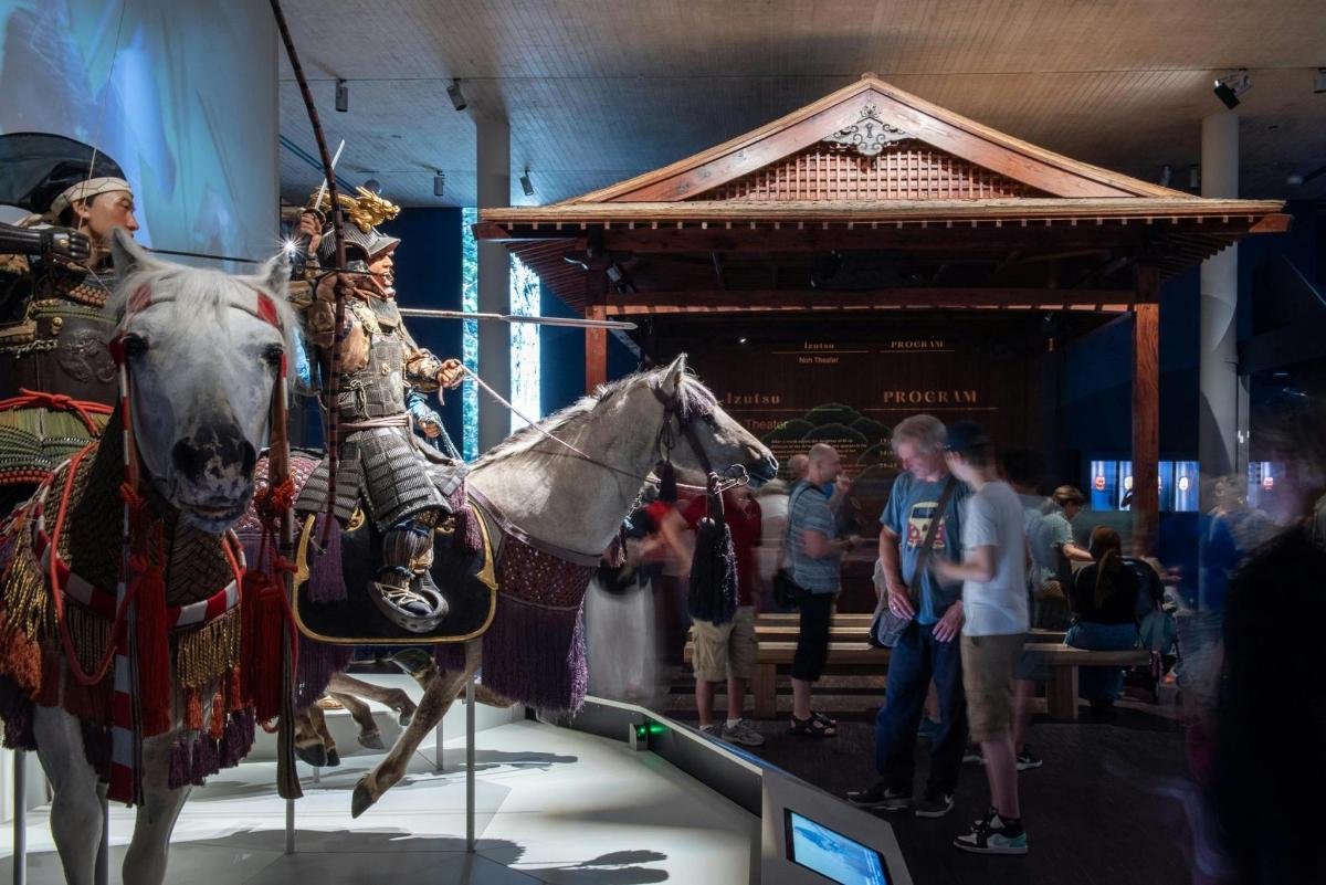 a statue of a man on a horse in a museum
