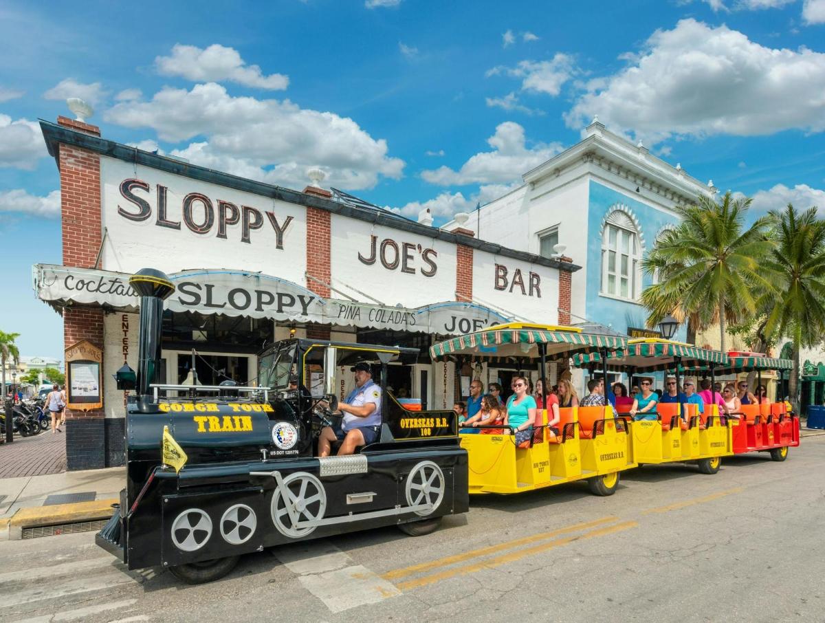a train full of people riding on a roller coaster