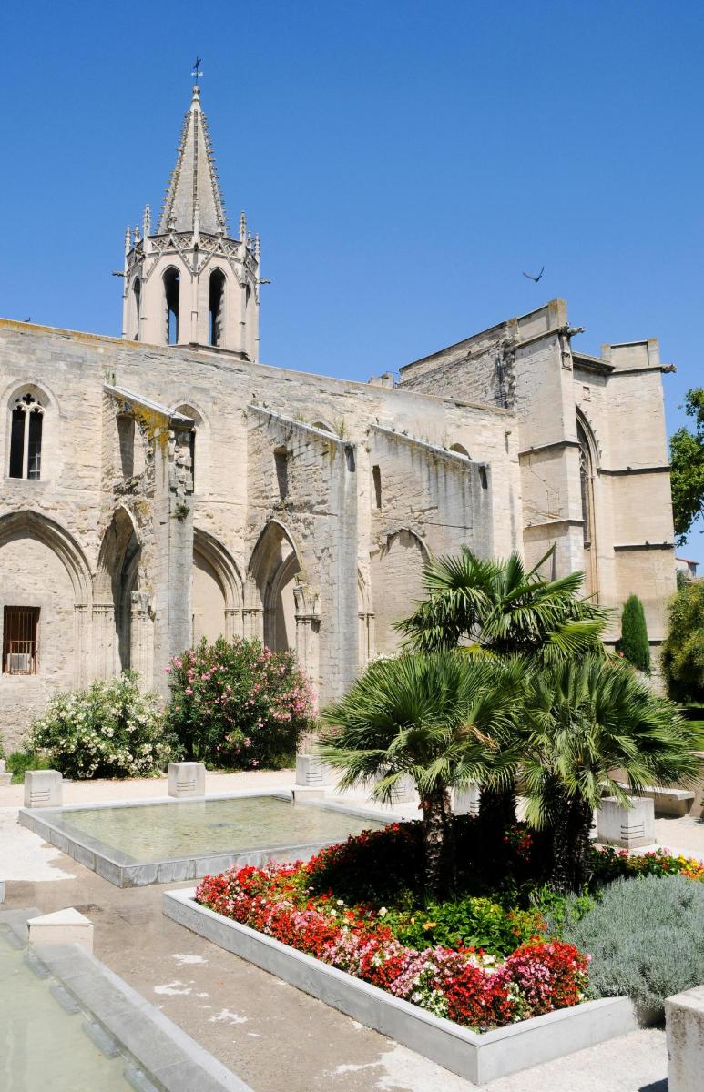 a church with a palm tree in front of it