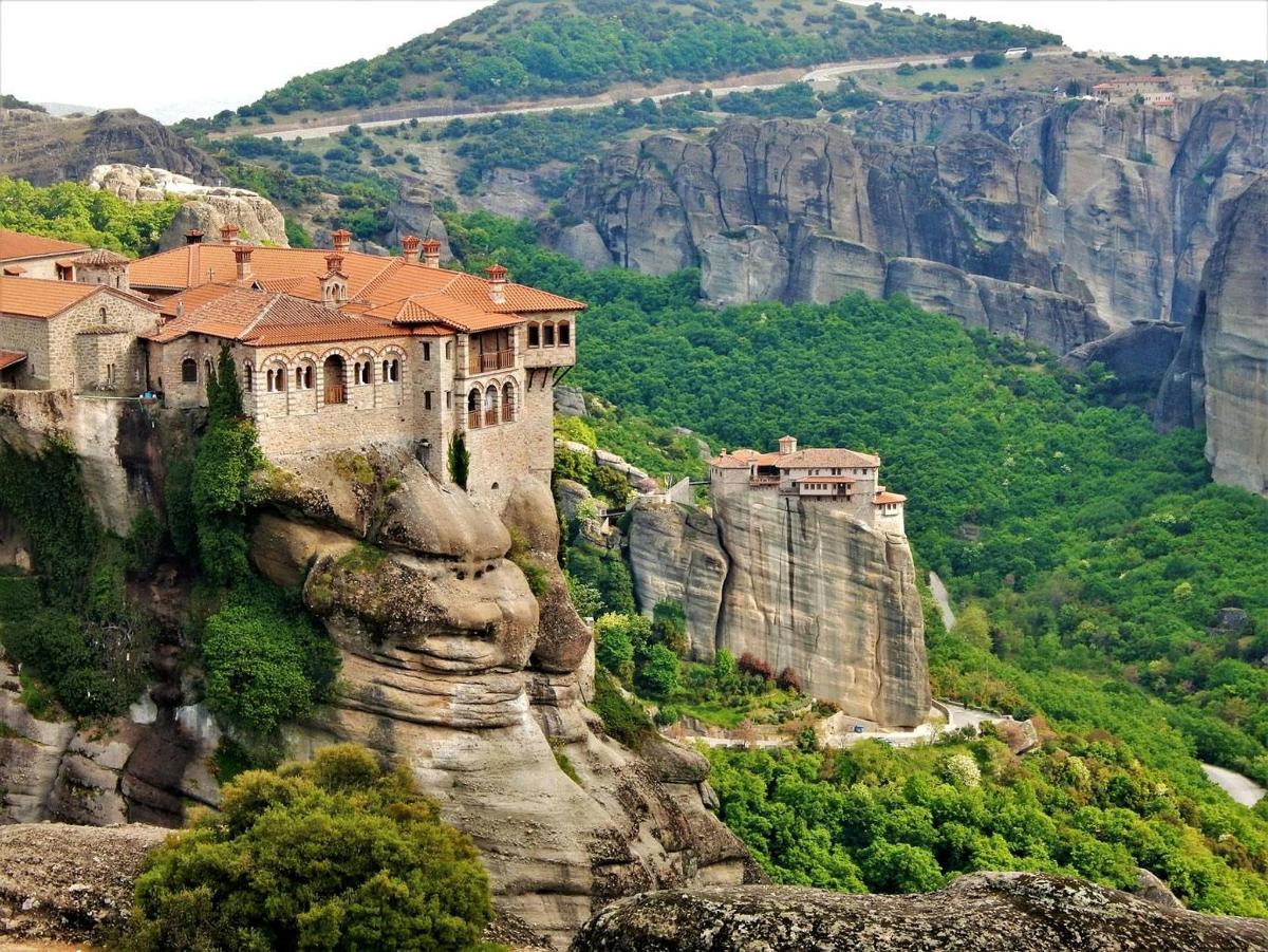 a castle on the side of a cliff