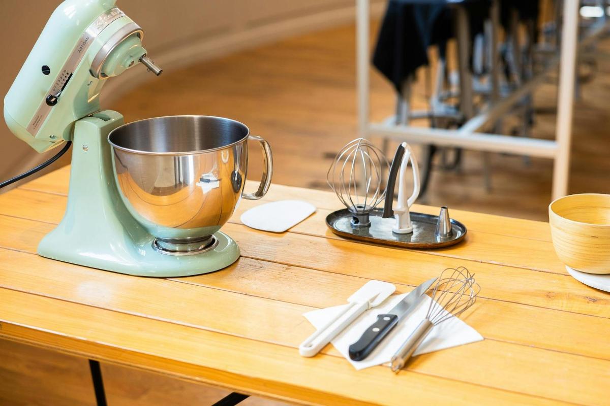 a mixer sitting on top of a wooden table