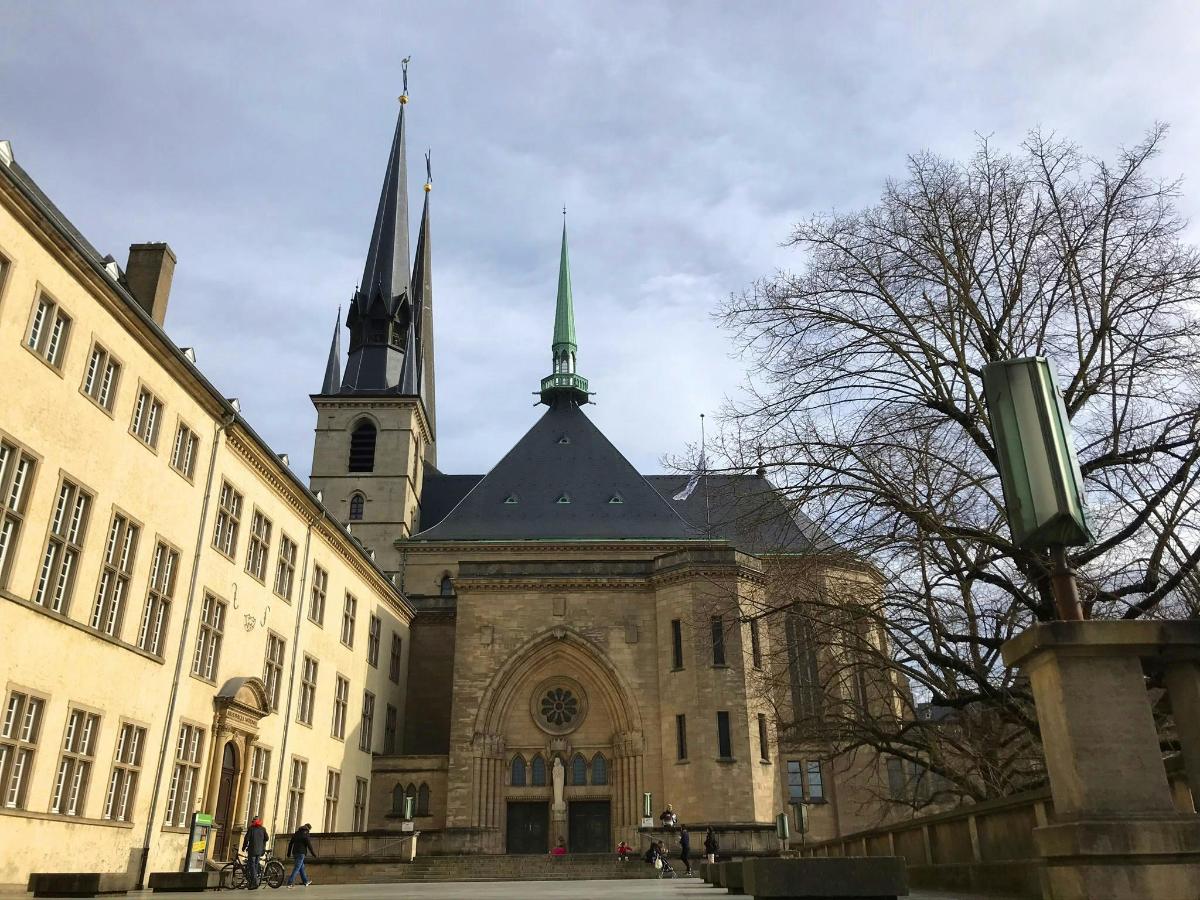 an old building with a church in the background