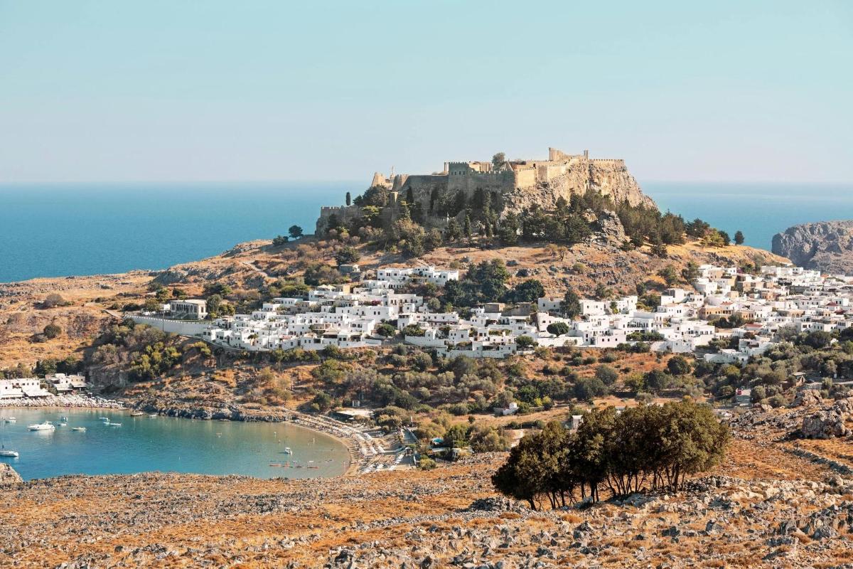 an island with a castle on top of a hill