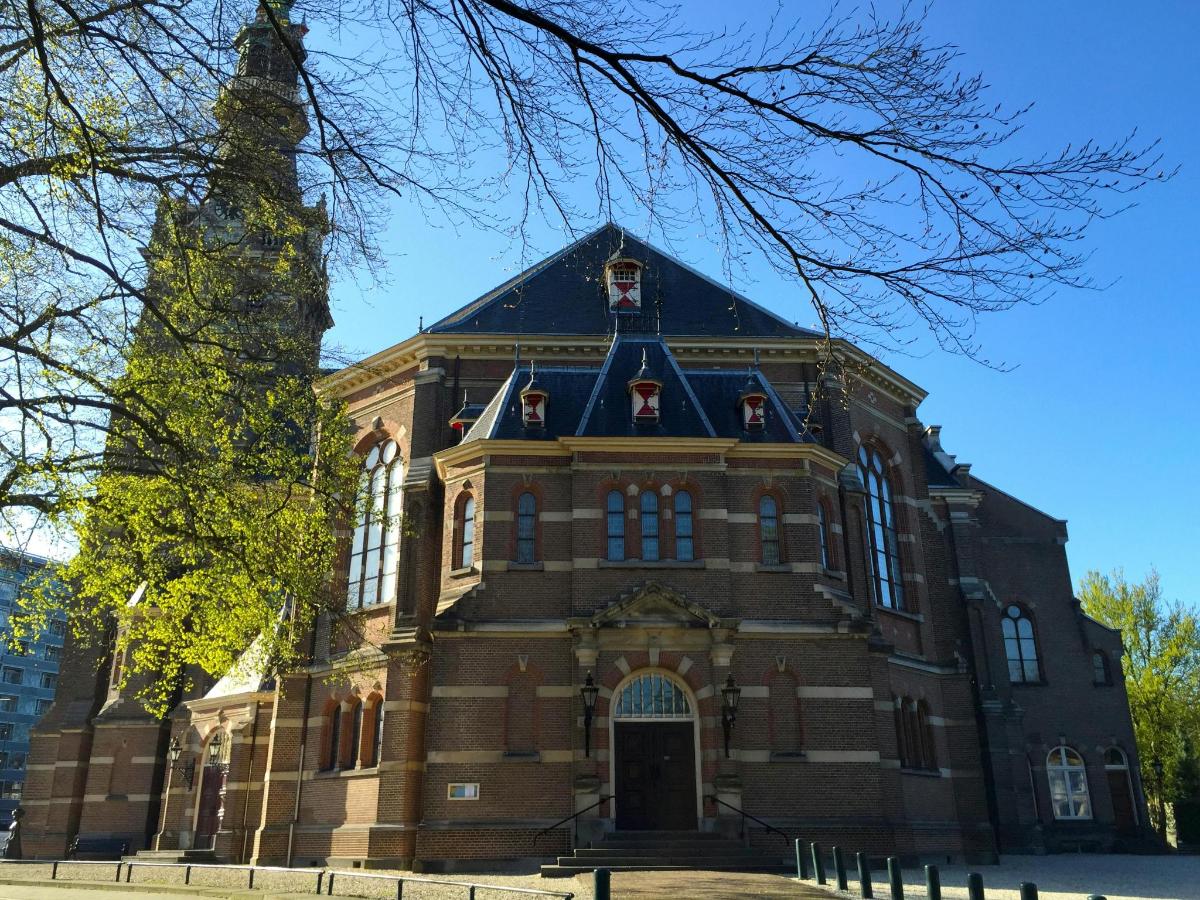 a large brick building with a tower on top