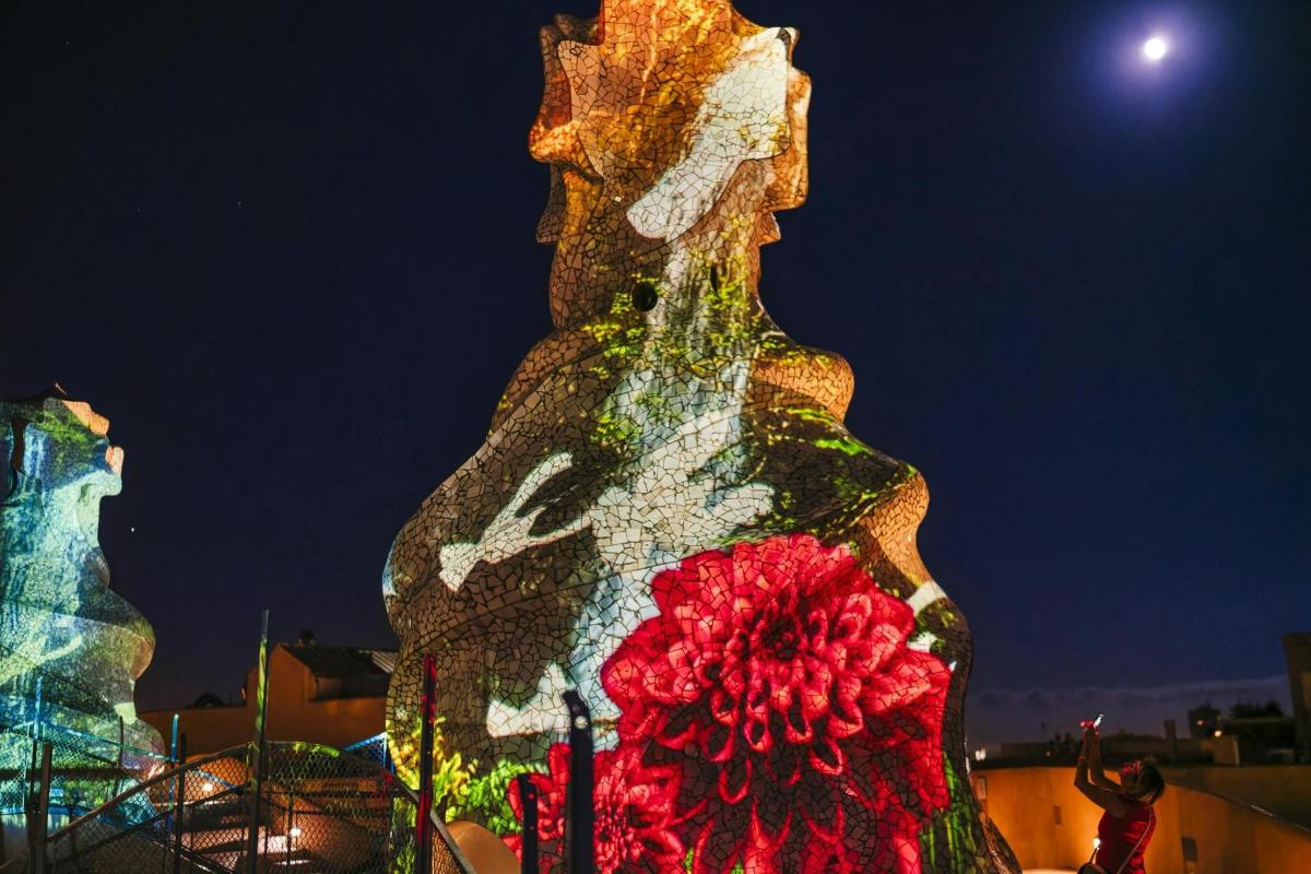 a sculpture of a woman with a flower on it